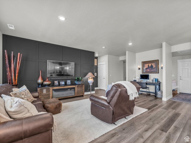 1136 W 1810 S, Orem, UT 84058 - living area featuring wood finished floors, baseboards, a decorative wall, and recessed lighting