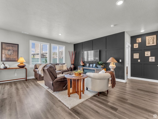 1136 W 1810 S, Orem, UT 84058 - living room with a textured ceiling, light wood finished floors, baseboards, and recessed lighting