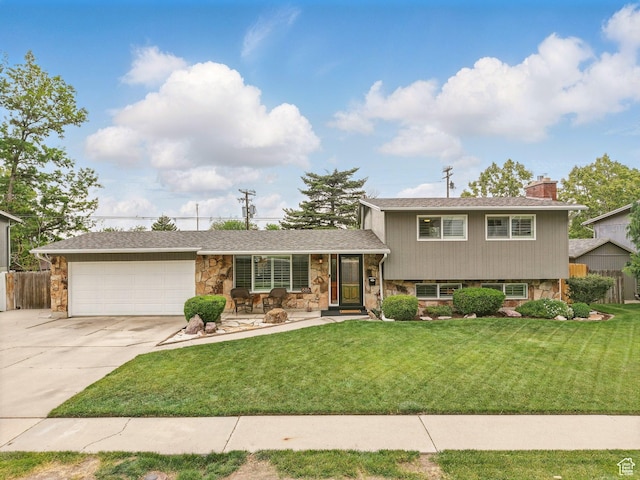 686 Idaho Ave, Provo, UT 84606 - tri-level home featuring stone siding, concrete driveway, an attached garage, and a chimney