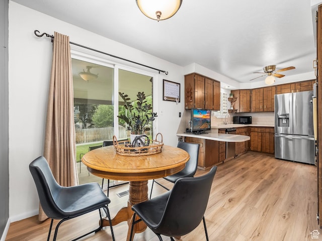 686 Idaho Ave, Provo, UT 84606 - dining area with light wood-type flooring and a ceiling fan