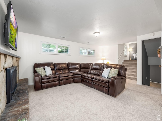 686 Idaho Ave, Provo, UT 84606 - living area featuring carpet floors, stairway, and a fireplace with raised hearth