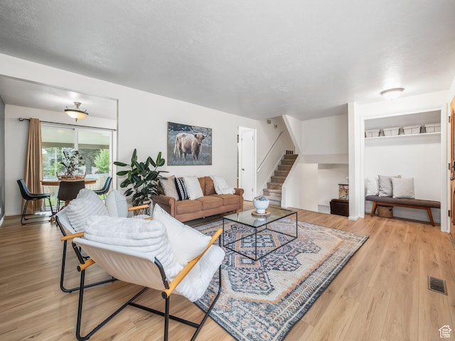686 Idaho Ave, Provo, UT 84606 - living area with stairway and light wood-style floors
