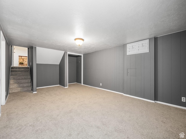 686 Idaho Ave, Provo, UT 84606 - finished below grade area with a textured ceiling, carpet, stairs, and baseboards