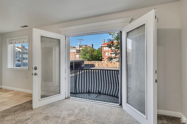 1255 E 200 S # 10, Salt Lake City, UT 84102 - entryway featuring carpet floors, baseboards, and tile patterned floors