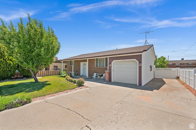 3279 W Crestfield, West Valley City, UT 84119 - view of front of home featuring an attached garage and driveway