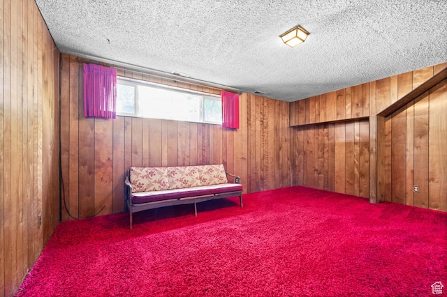 3279 W Crestfield, West Valley City, UT 84119 - living area featuring wood walls, a textured ceiling, and carpet floors