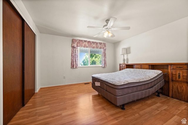 3279 W Crestfield, West Valley City, UT 84119 - bedroom with light wood-style flooring, a closet, ceiling fan, and baseboards