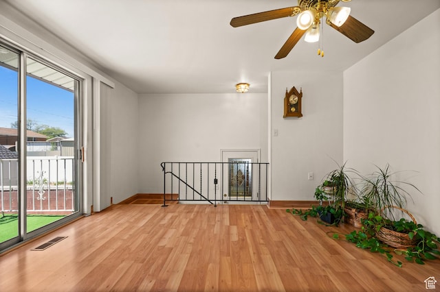 3279 W Crestfield, West Valley City, UT 84119 - empty room featuring light wood-style flooring, baseboards, and a ceiling fan