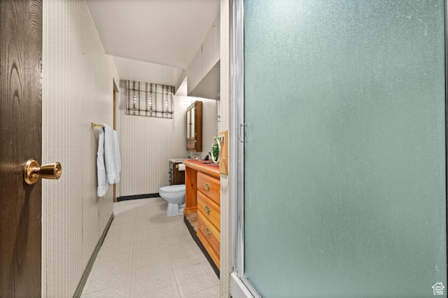 3279 W Crestfield, West Valley City, UT 84119 - bathroom with vanity, toilet, tile patterned floors, a shower with shower door, and baseboards