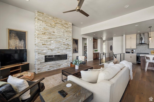 11661 N Shoreline Dr, Hideout, UT 84036 - living room with a ceiling fan, a stone fireplace, dark wood-style flooring, and recessed lighting