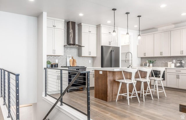 11661 N Shoreline Dr, Hideout, UT 84036 - kitchen with wall chimney exhaust hood, high end appliances, tasteful backsplash, recessed lighting, and a breakfast bar