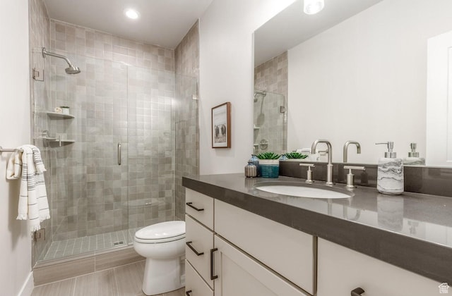 11661 N Shoreline Dr, Hideout, UT 84036 - bathroom featuring vanity, toilet, a stall shower, and recessed lighting