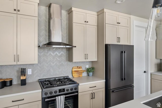 11661 N Shoreline Dr, Hideout, UT 84036 - kitchen featuring wall chimney range hood, stainless steel appliances, light countertops, and tasteful backsplash