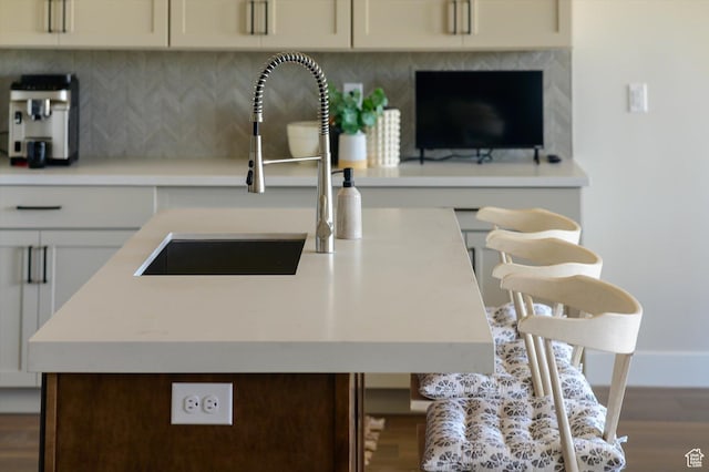 11661 N Shoreline Dr, Hideout, UT 84036 - kitchen featuring a sink, wood finished floors, light countertops, and backsplash