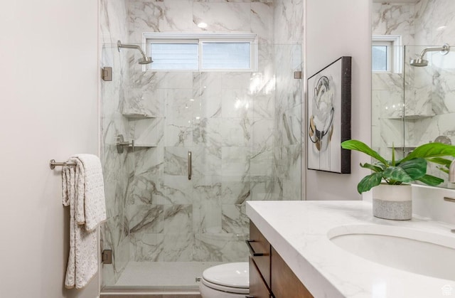 11661 N Shoreline Dr, Hideout, UT 84036 - bathroom featuring a marble finish shower, vanity, and toilet