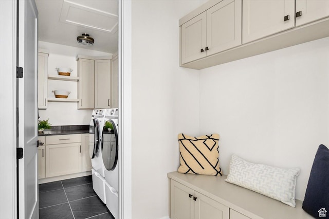 11661 N Shoreline Dr, Hideout, UT 84036 - washroom featuring independent washer and dryer, cabinet space, and dark tile patterned flooring