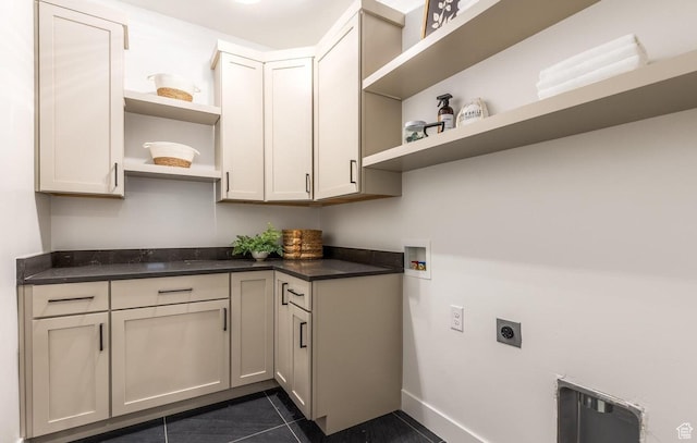 11661 N Shoreline Dr, Hideout, UT 84036 - laundry area with electric dryer hookup, dark tile patterned floors, hookup for a washing machine, cabinet space, and baseboards