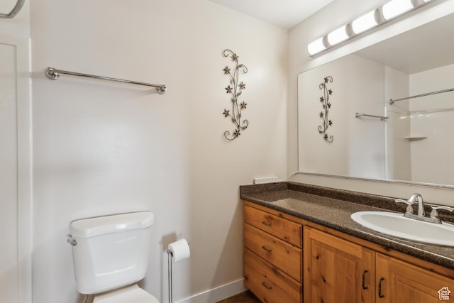 595 S Main St Unit 26, Kamas, UT 84036 - bathroom featuring toilet, vanity, baseboards, and a shower