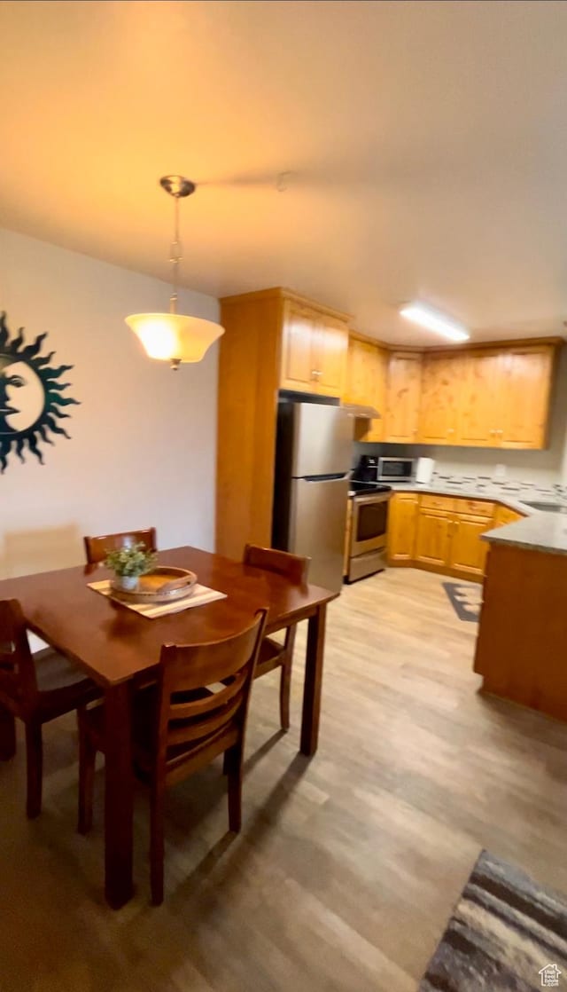 595 S Main St Unit 26, Kamas, UT 84036 - dining space with light wood-style floors