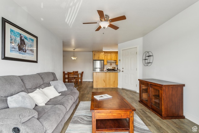 595 S Main St Unit 26, Kamas, UT 84036 - living area with dark wood-type flooring, a ceiling fan, and baseboards
