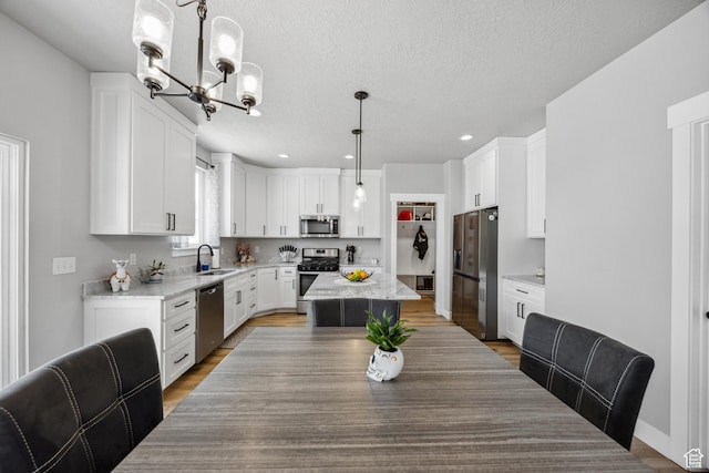 1228 N 100 E, Nephi, UT 84648 - dining space with a chandelier, a textured ceiling, light wood-type flooring, and recessed lighting