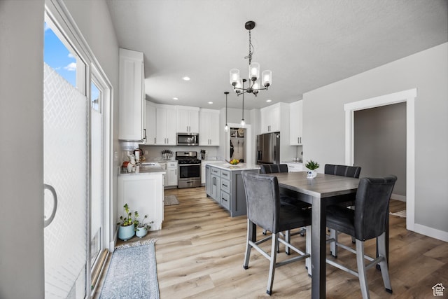 1228 N 100 E, Nephi, UT 84648 - dining room with a chandelier, light wood-type flooring, recessed lighting, and baseboards