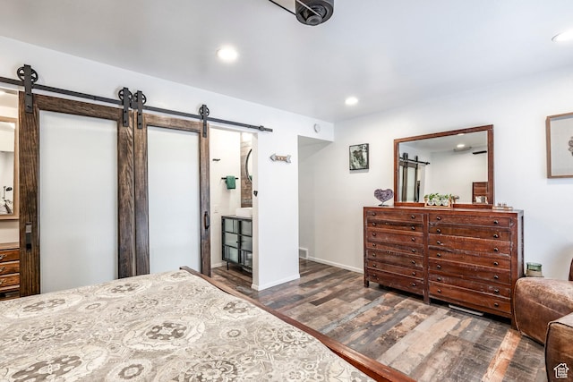 4097 S 670 E Unit C, Murray, UT 84107 - bedroom featuring a barn door, wood finished floors, recessed lighting, baseboards, and connected bathroom