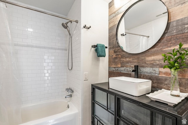 4097 S 670 E Unit C, Murray, UT 84107 - bathroom featuring shower / bath combo, vanity, and wooden walls