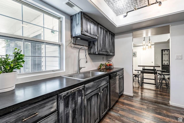 4097 S 670 E Unit C, Murray, UT 84107 - kitchen featuring stainless steel dishwasher, a sink, dark countertops, dark wood-type flooring, and a tray ceiling