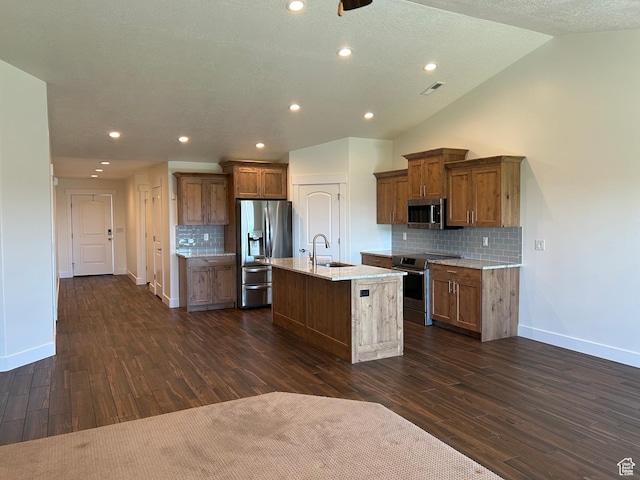 1224 S Grace Way, Layton, UT 84041 - kitchen featuring stainless steel appliances, a sink, baseboards, an island with sink, and decorative backsplash
