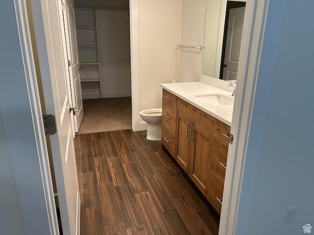 1224 S Grace Way, Layton, UT 84041 - bathroom with wood finish floors, vanity, toilet, and baseboards