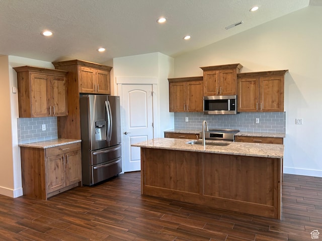 1224 S Grace Way, Layton, UT 84041 - kitchen with appliances with stainless steel finishes, brown cabinetry, dark wood finished floors, a sink, and recessed lighting