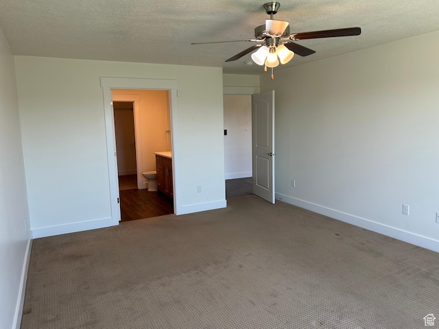 1224 S Grace Way, Layton, UT 84041 - unfurnished bedroom with carpet flooring, baseboards, connected bathroom, a textured ceiling, and ceiling fan