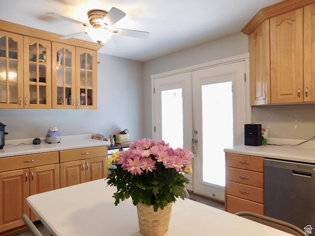 9467 S 250 E, Sandy, UT 84070 - kitchen featuring stainless steel dishwasher, light countertops, healthy amount of natural light, and glass insert cabinets