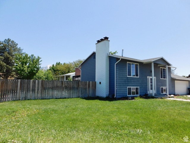 9467 S 250 E, Sandy, UT 84070 - back of property with a chimney and a garage
