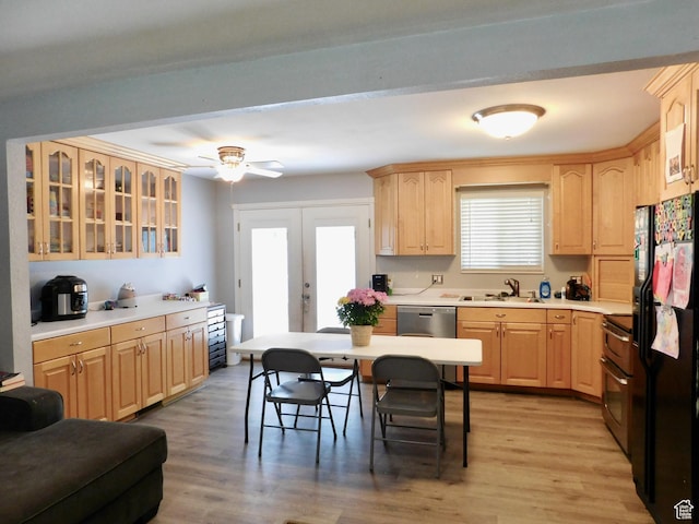9467 S 250 E, Sandy, UT 84070 - kitchen with light brown cabinetry, black fridge, glass insert cabinets, and double oven range