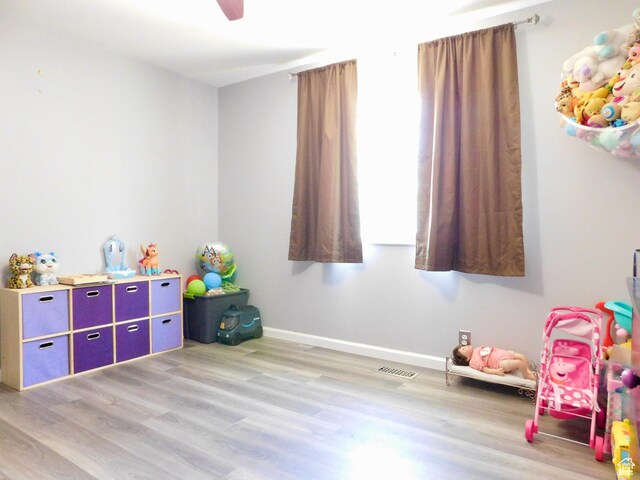 9467 S 250 E, Sandy, UT 84070 - playroom featuring light wood-style flooring, baseboards, and a ceiling fan