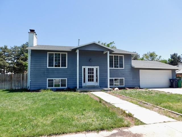 9467 S 250 E, Sandy, UT 84070 - split foyer home with an attached garage, a chimney, and driveway