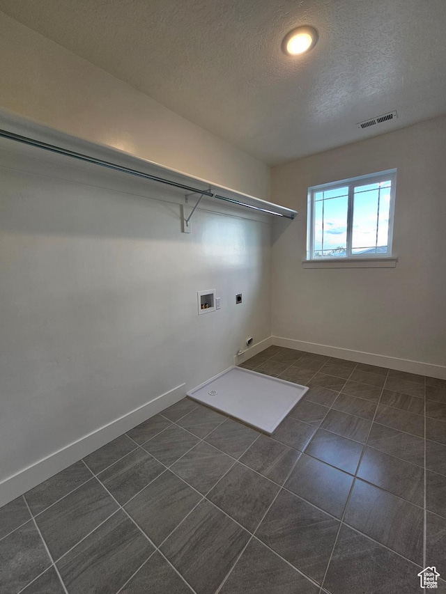 454 N 500 E Lot 3, Salem, UT 84653 - washroom featuring electric dryer hookup, hookup for a washing machine, a textured ceiling, dark tile patterned flooring, and baseboards