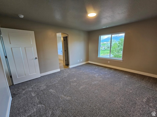 454 N 500 E Lot 3, Salem, UT 84653 - carpeted spare room with arched walkways, baseboards, a textured ceiling, and a smoke detector