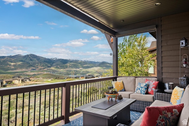 10371 N Sightline Cir, Hideout, UT 84036 - wooden deck featuring an outdoor hangout area and a mountain view
