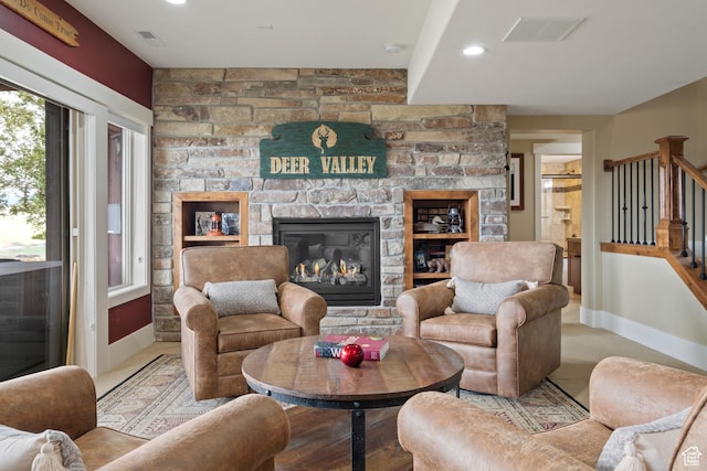 10371 N Sightline Cir, Hideout, UT 84036 - living area with baseboards, stairway, a stone fireplace, and recessed lighting