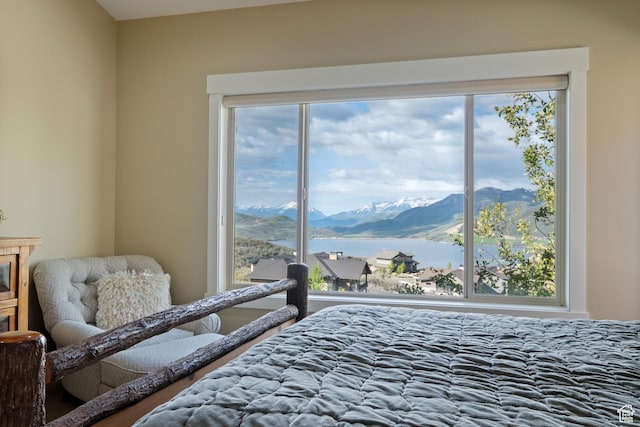 10371 N Sightline Cir, Hideout, UT 84036 - bedroom featuring multiple windows and a water and mountain view