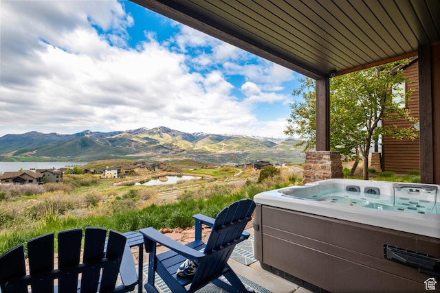 10371 N Sightline Cir, Hideout, UT 84036 - view of patio with a hot tub and a water and mountain view