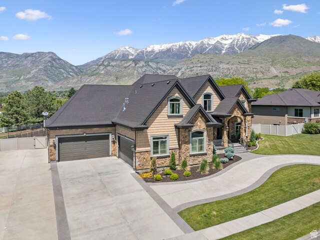 62 W 225 N, Lindon, UT 84042 - view of front of house with stone siding, concrete driveway, and a mountain view