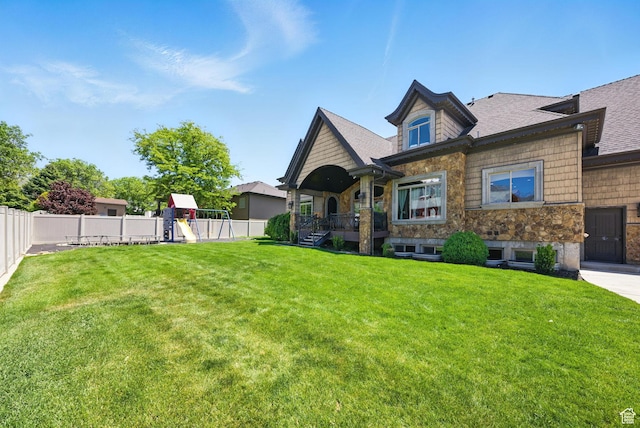 62 W 225 N, Lindon, UT 84042 - view of front facade with a playground, stone siding, and a shingled roof