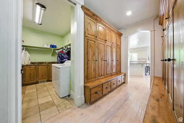 62 W 225 N, Lindon, UT 84042 - laundry area featuring washer / clothes dryer, cabinet space, arched walkways, light wood-style flooring, and recessed lighting
