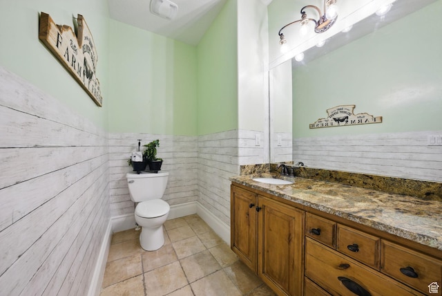 62 W 225 N, Lindon, UT 84042 - bathroom featuring toilet, vanity, tile patterned floors, and a wainscoted wall