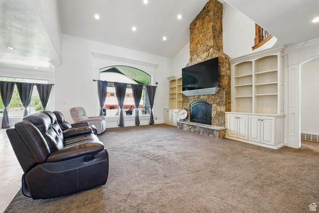 62 W 225 N, Lindon, UT 84042 - carpeted living room featuring high vaulted ceiling, recessed lighting, a stone fireplace, and built in shelves