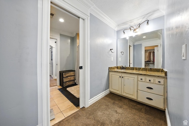 62 W 225 N, Lindon, UT 84042 - bathroom with ornamental molding, vanity, tile patterned floors, baseboards, and a spacious closet